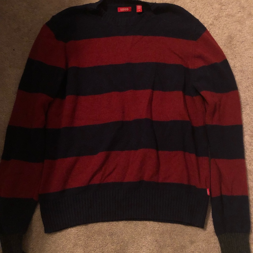 This striped crew neck is blue and burnt orange/red and a size M